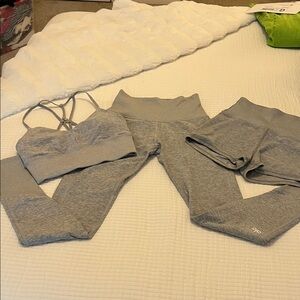 ALO Yoga Heather Gray Strappy Sports Bra, leggings, and shorts